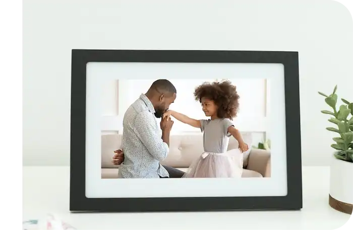 Father and daughter ballet picture displayed on a Skylight Black Frame